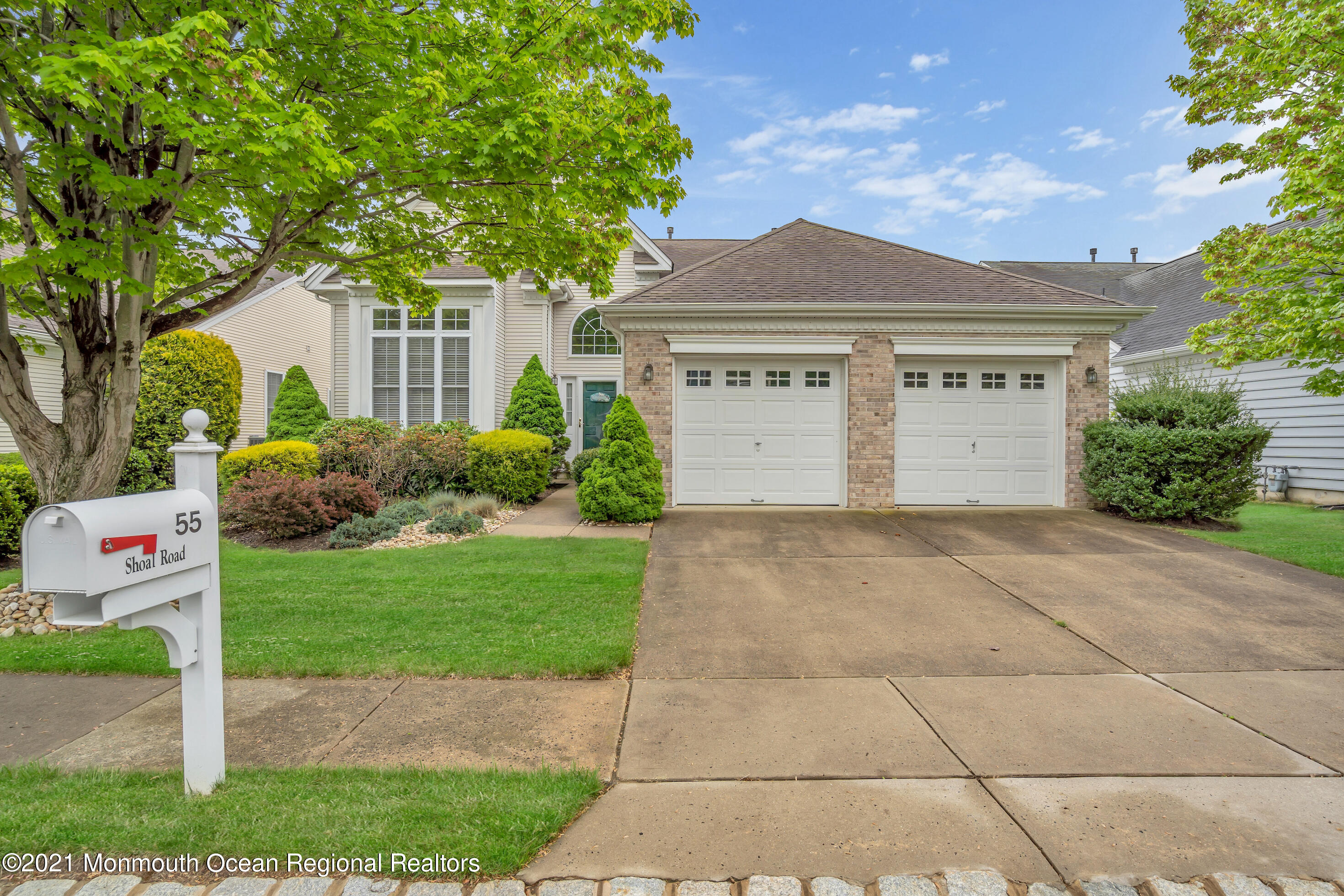 55 Shoal Road Jackson, NJ 08527 - Photo 9 of 55 a front view of a house with a garden and plants