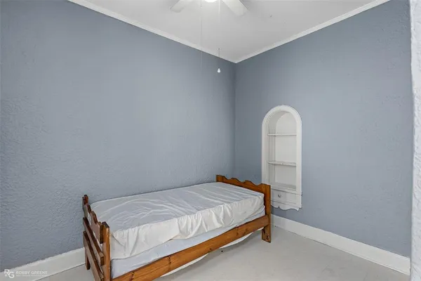 a bedroom with a bed and a table