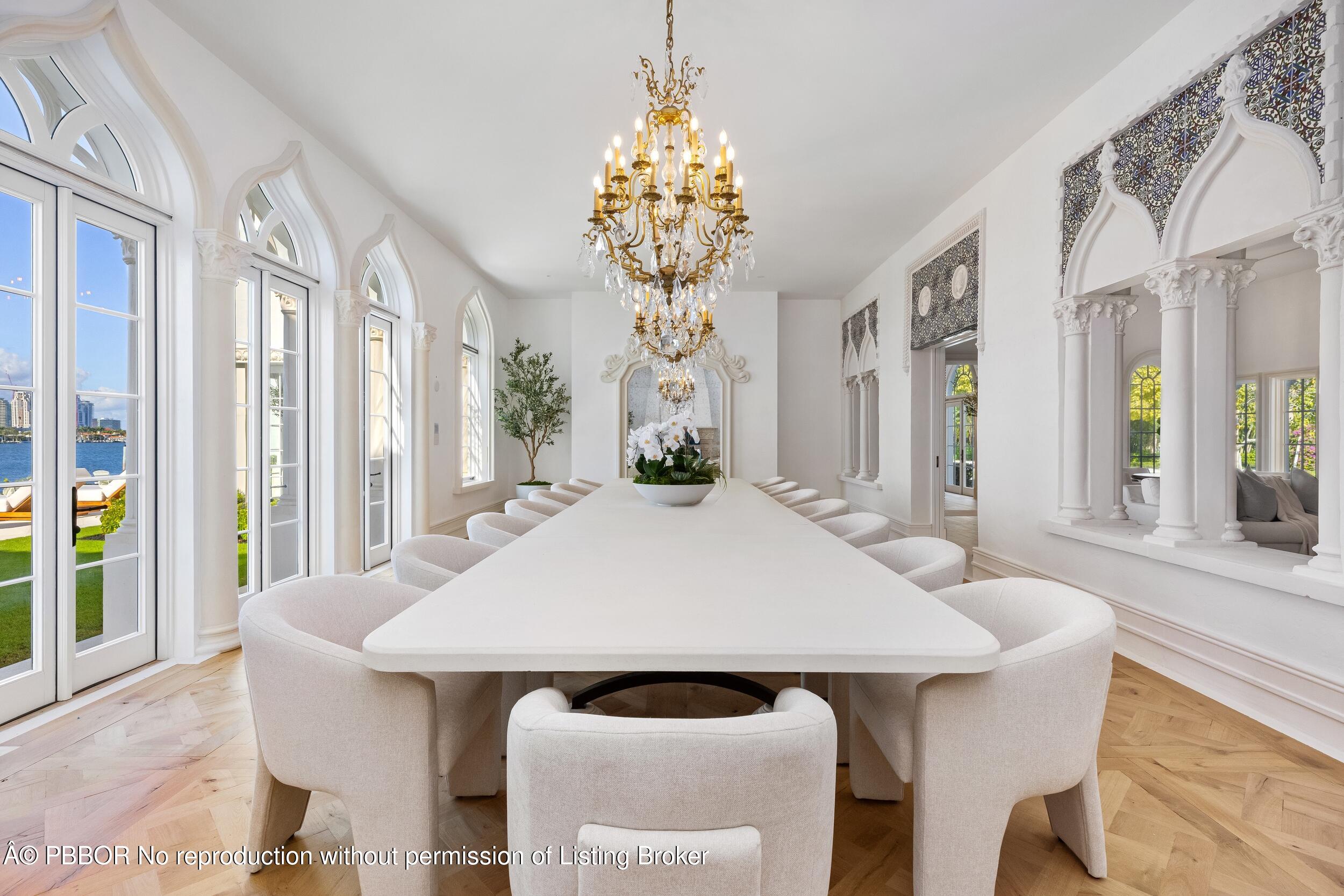 800 South County Road Palm Beach, FL 33480 - Photo 39 of 76 a dining room with a table and chairs