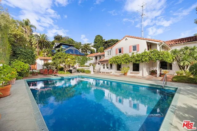 a view of swimming pool with seating space