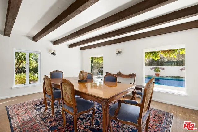 a view of a dining room with furniture and window