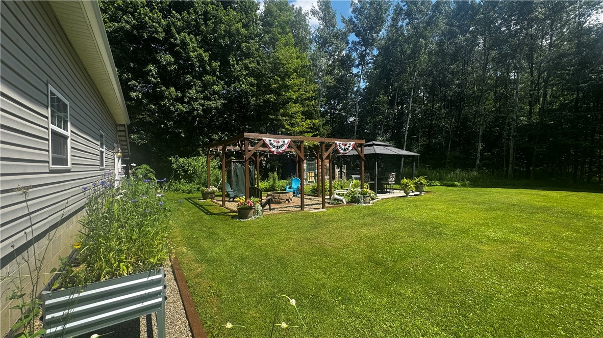 87 Collins Road Lewis Run, PA 16738 - Photo 36 of 48 Back yard with gardens and entertainment space