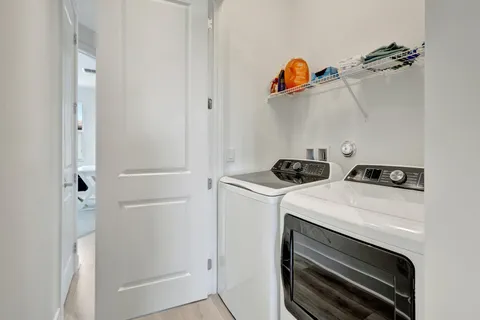 a bedroom with a bed and a cabinet