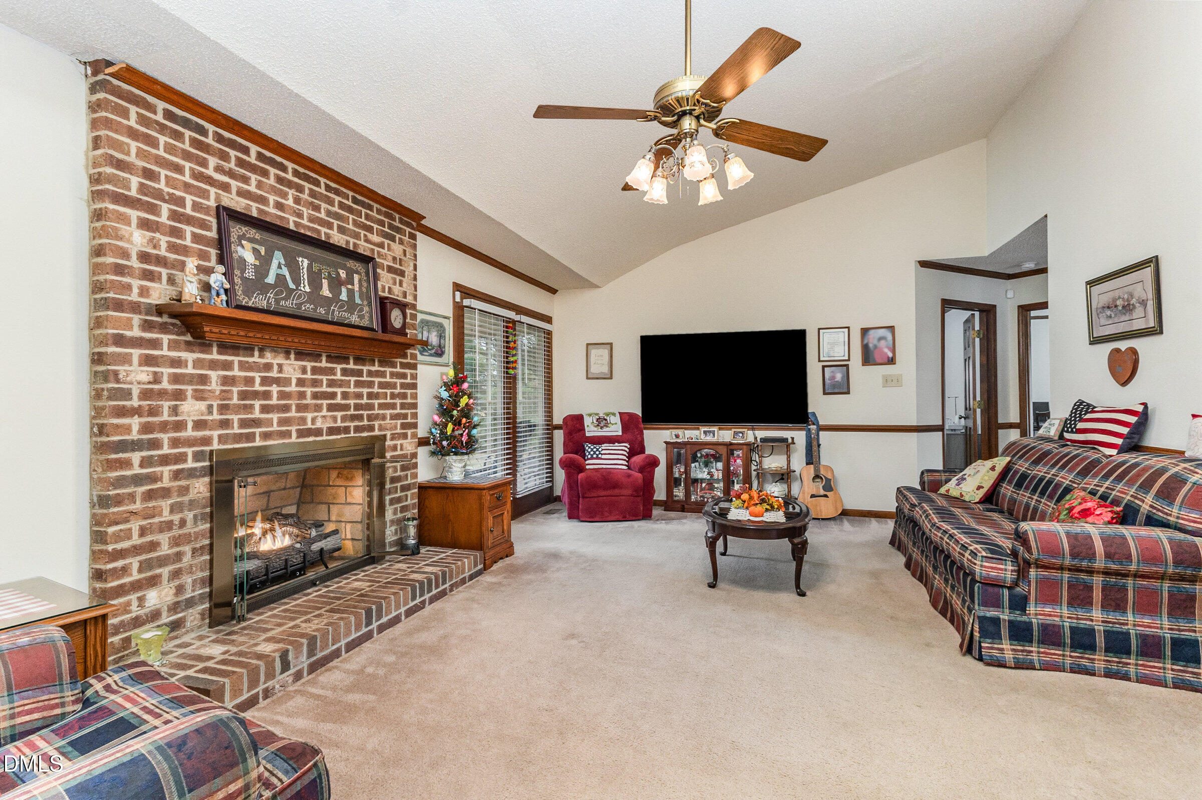 390 Sandy Ridge Road Dunn, NC 28334 - Photo 10 of 45 a living room with furniture and a flat screen tv
