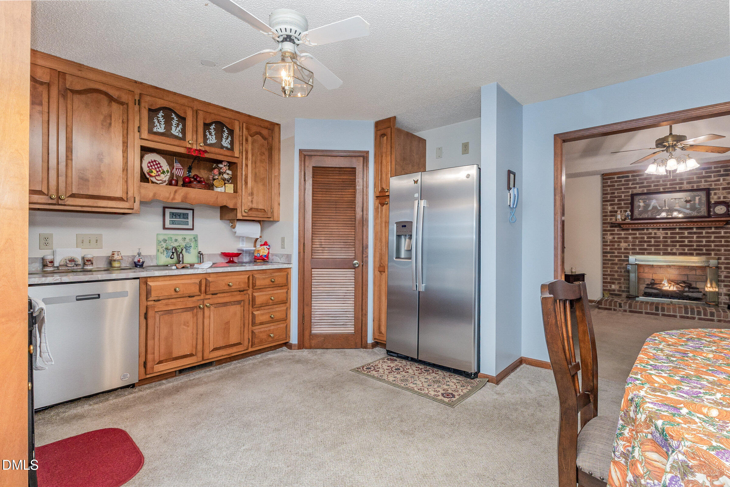 390 Sandy Ridge Road Dunn, NC 28334 - Photo 14 of 45 a kitchen with stainless steel appliances granite countertop a refrigerator and a sink