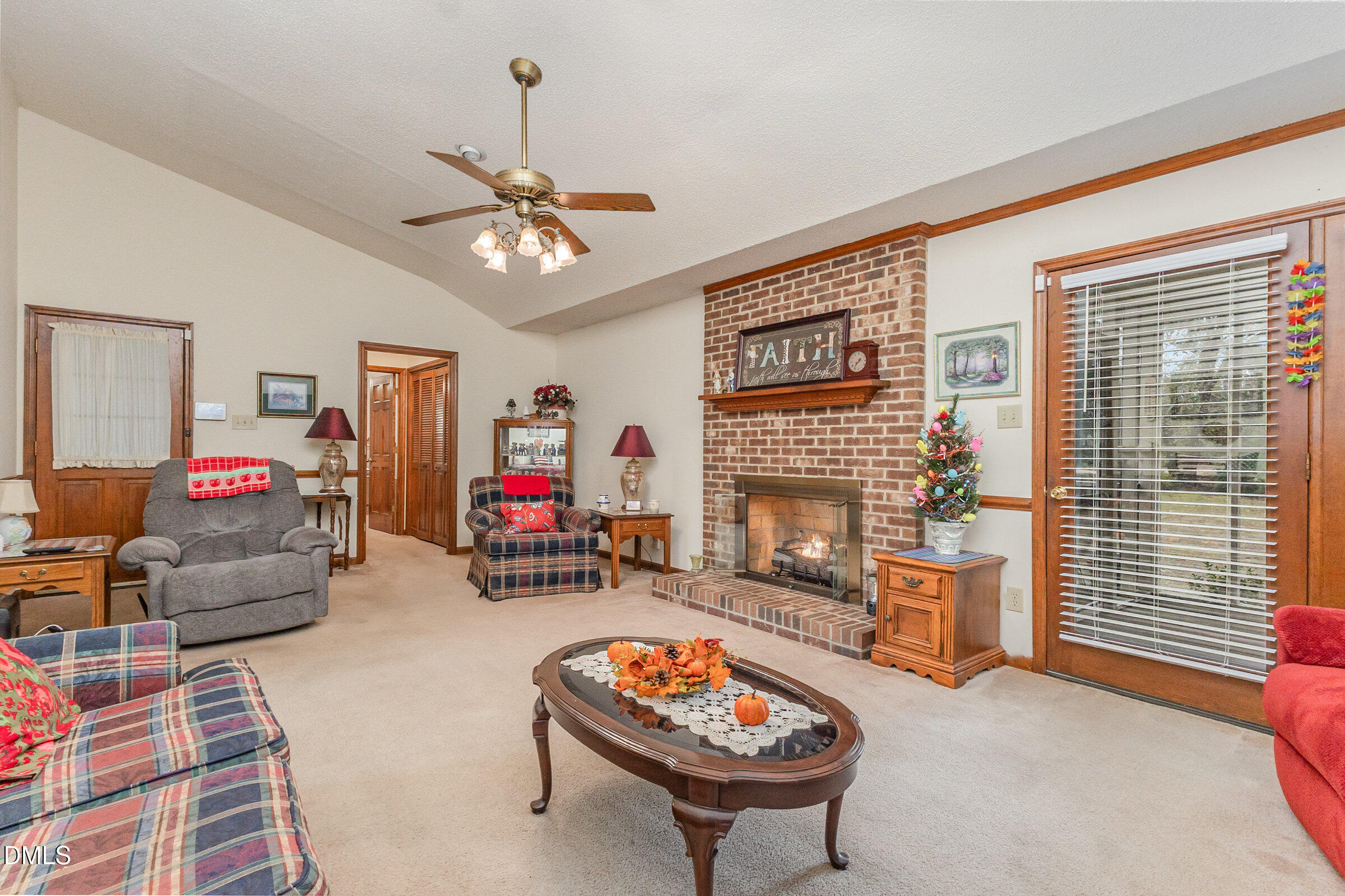 390 Sandy Ridge Road Dunn, NC 28334 - Photo 2 of 45 a living room with furniture and a fireplace