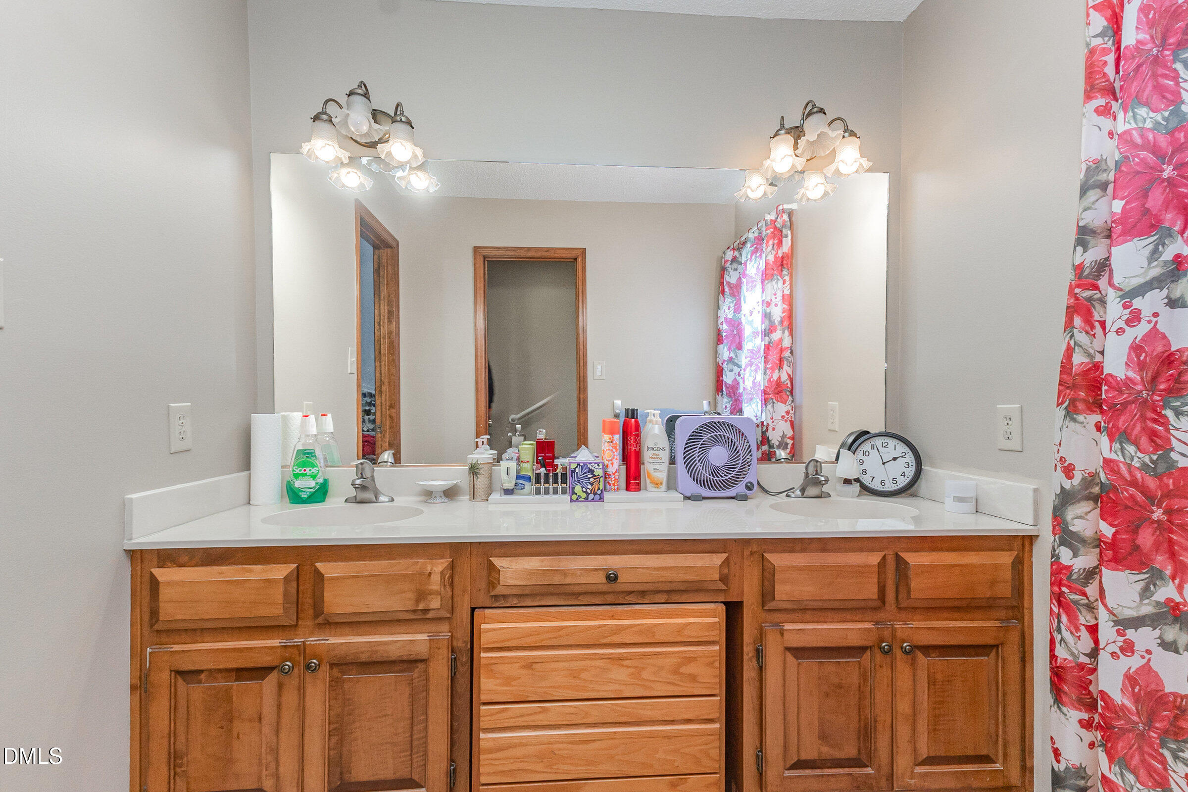 390 Sandy Ridge Road Dunn, NC 28334 - Photo 33 of 45 a bathroom with a sink and a mirror