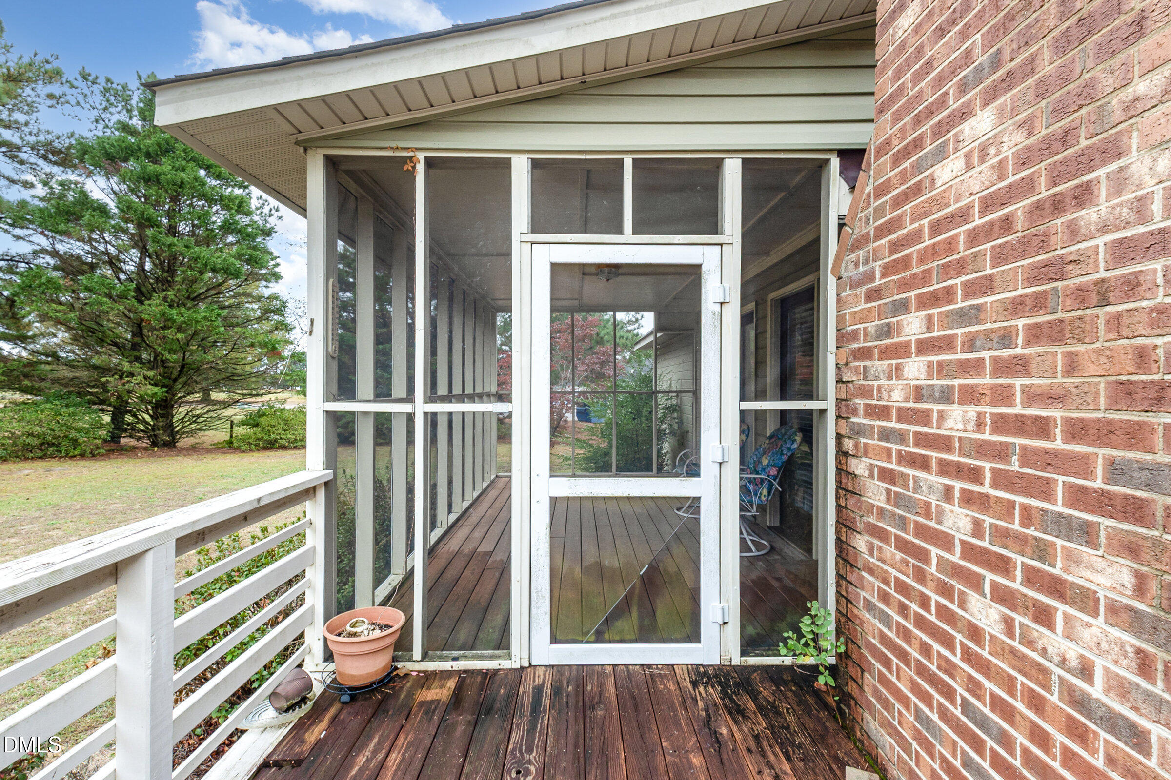 390 Sandy Ridge Road Dunn, NC 28334 - Photo 37 of 45 a view of a balcony with wooden floor and fence