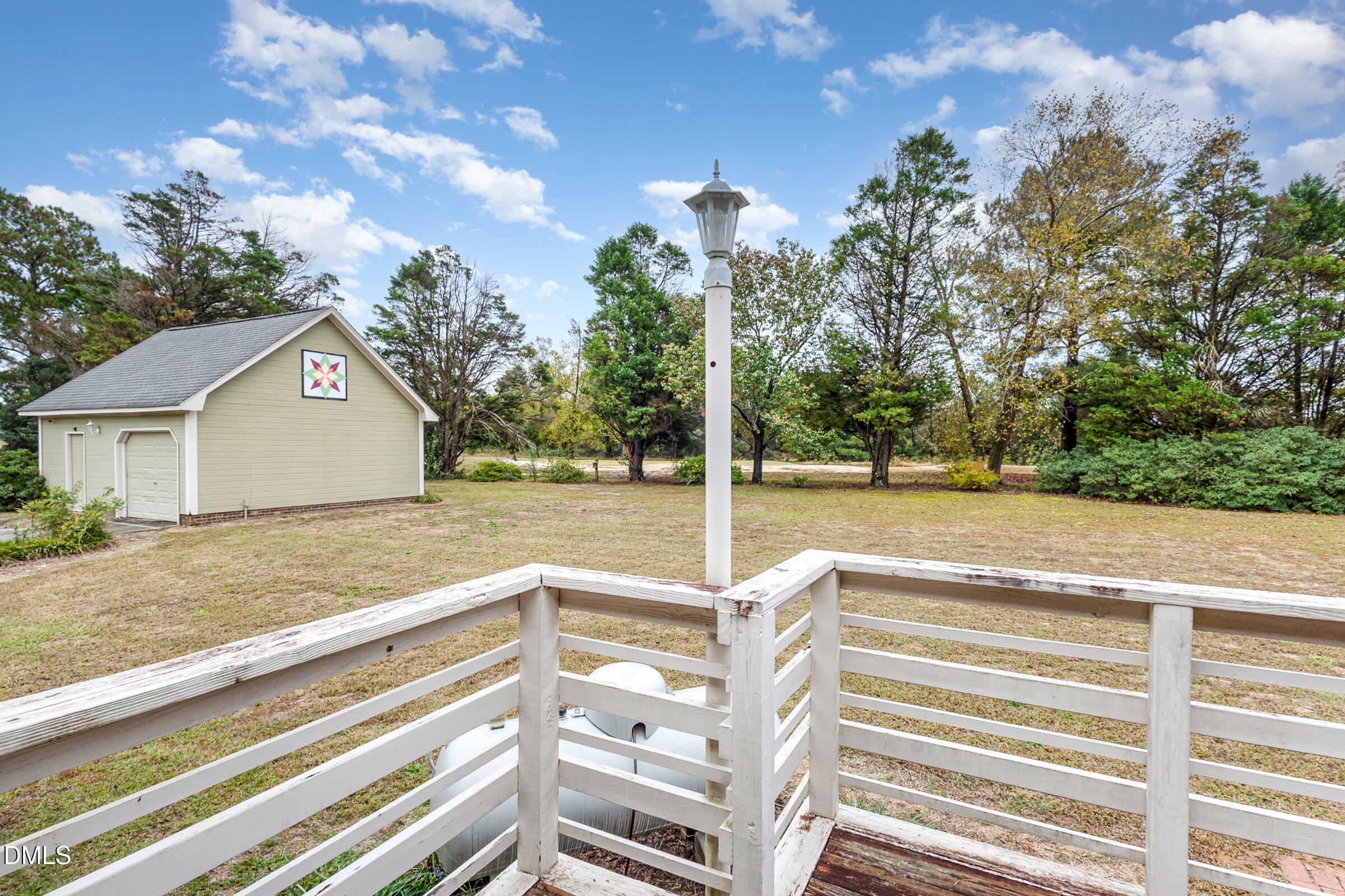 390 Sandy Ridge Road Dunn, NC 28334 - Photo 39 of 45 a view of a house with a backyard