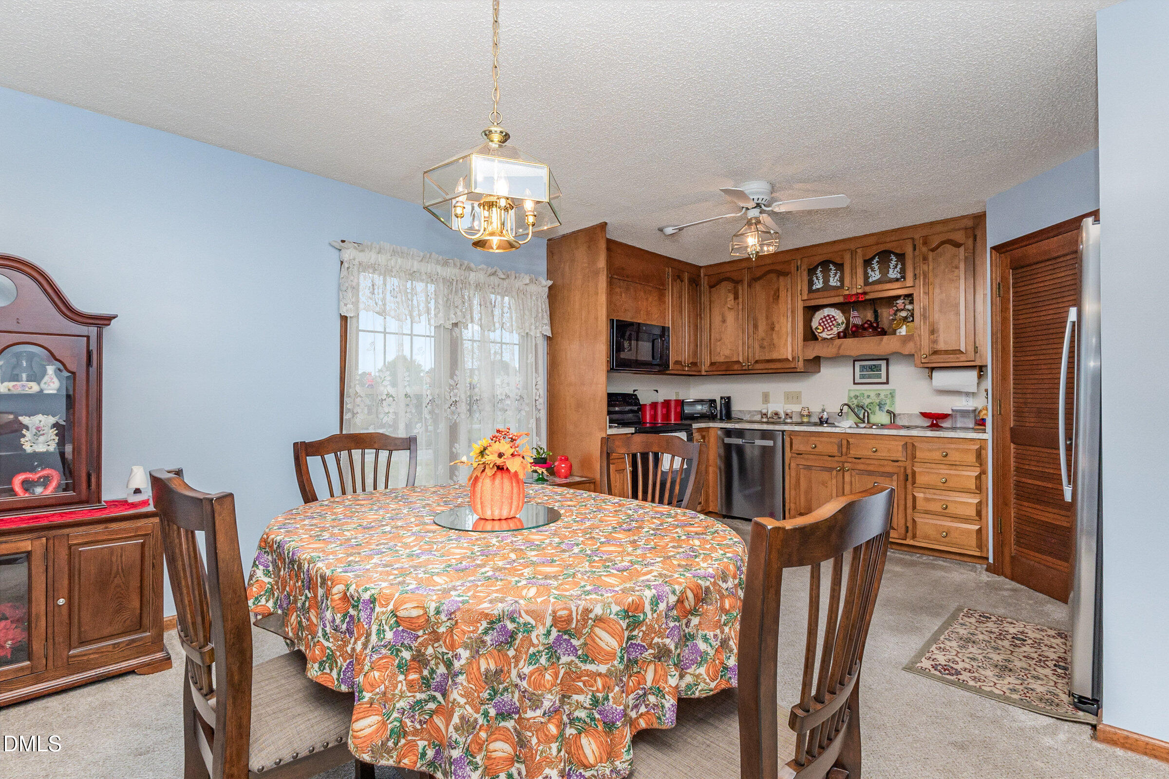 390 Sandy Ridge Road Dunn, NC 28334 - Photo 3 of 45 a view of a dining room with furniture