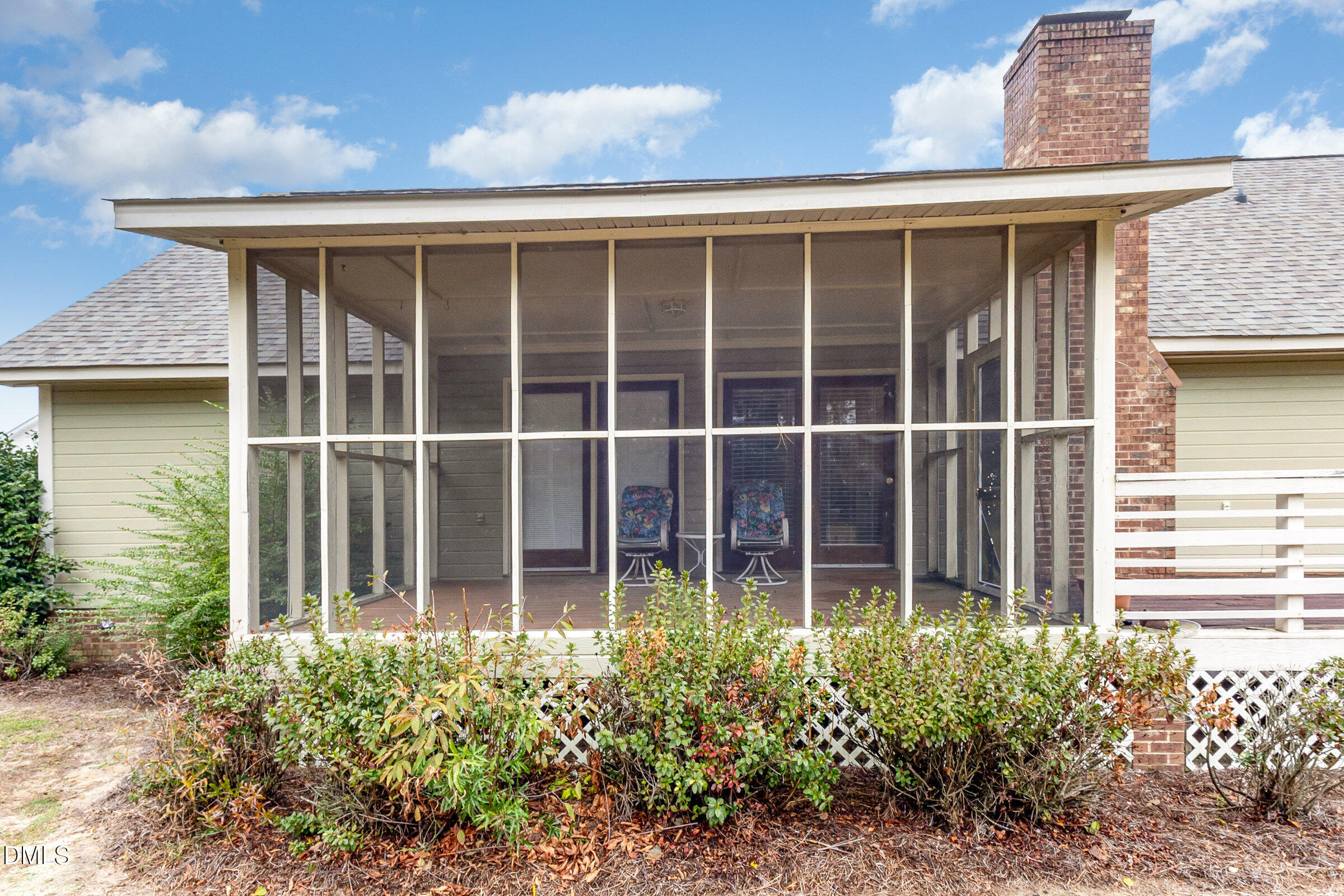 390 Sandy Ridge Road Dunn, NC 28334 - Photo 41 of 45 a view of a house with a garden