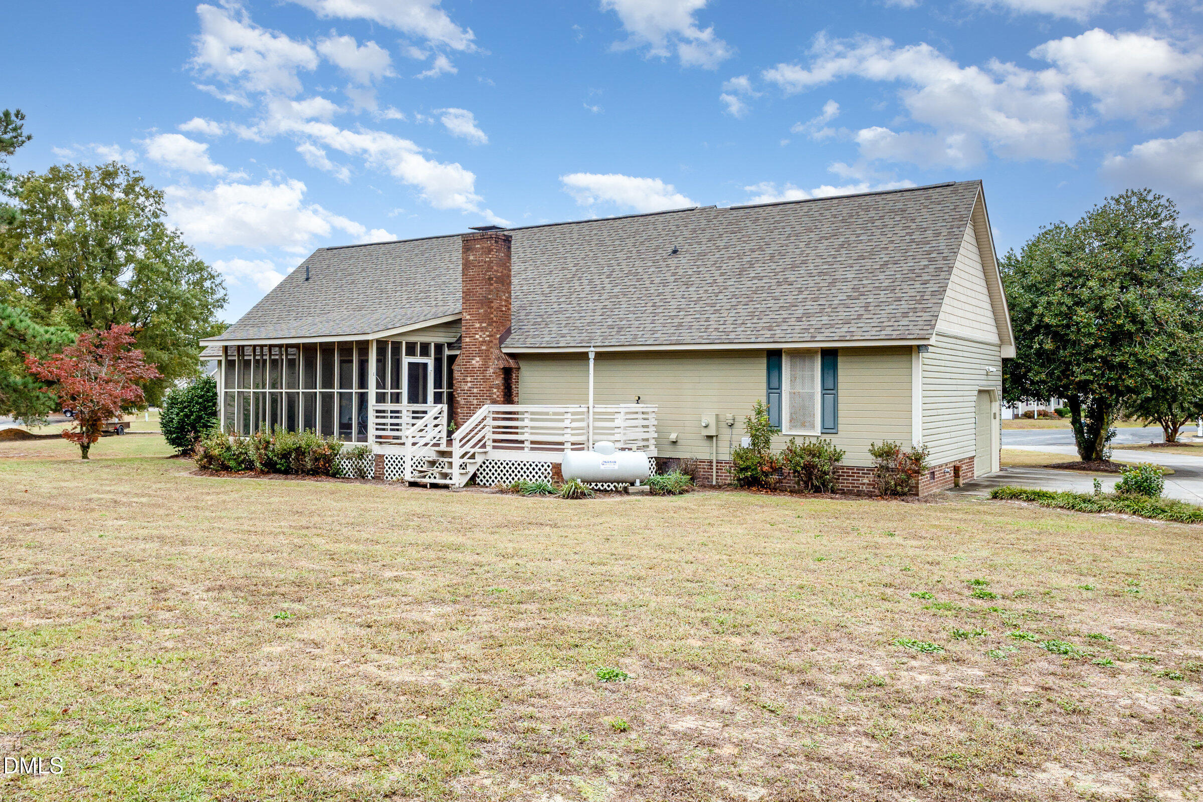 390 Sandy Ridge Road Dunn, NC 28334 - Photo 42 of 45 a front view of a house with a yard and garage