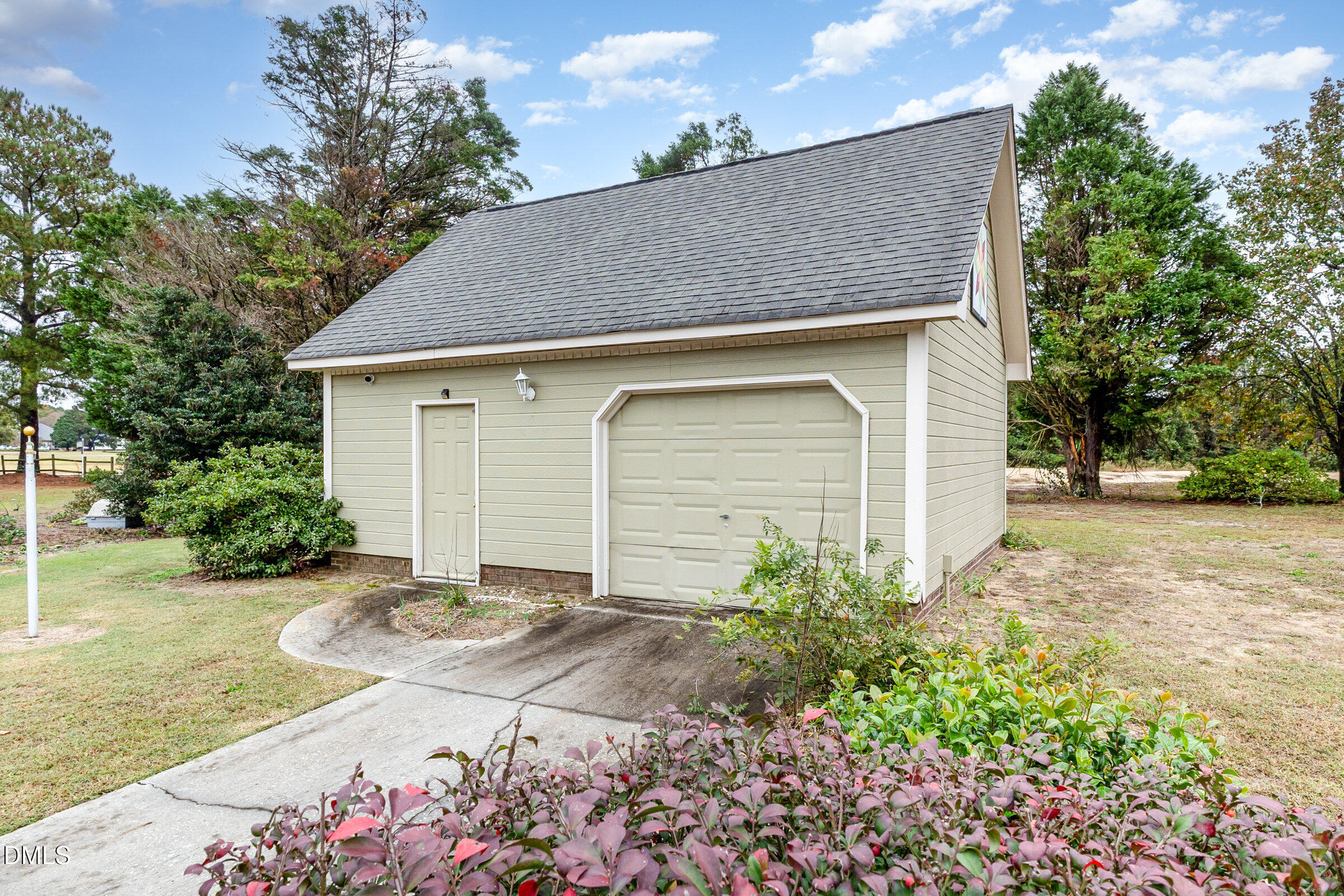 390 Sandy Ridge Road Dunn, NC 28334 - Photo 44 of 45 a front view of a house with a yard