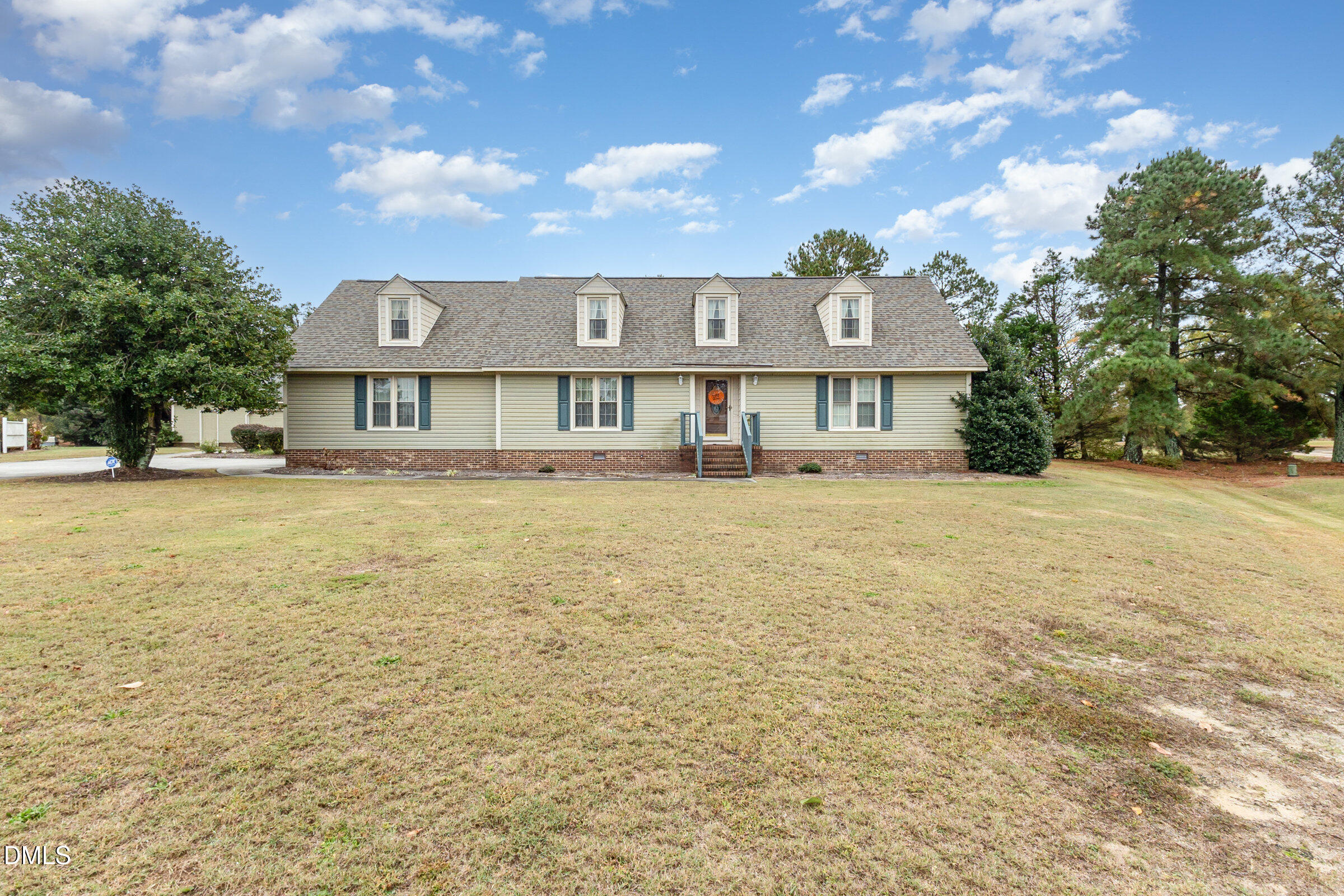 390 Sandy Ridge Road Dunn, NC 28334 - Photo 6 of 45 a view of a house with a yard
