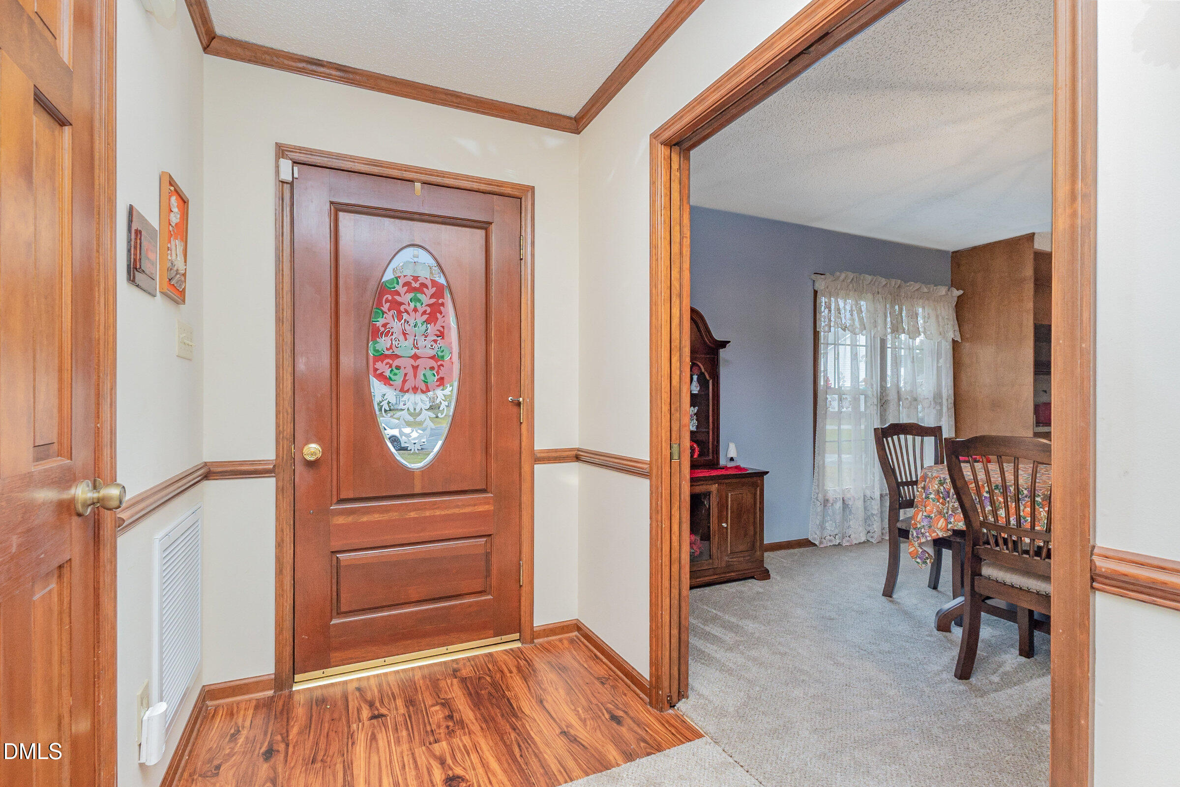390 Sandy Ridge Road Dunn, NC 28334 - Photo 9 of 45 a view of a hallway with workspace and mirror