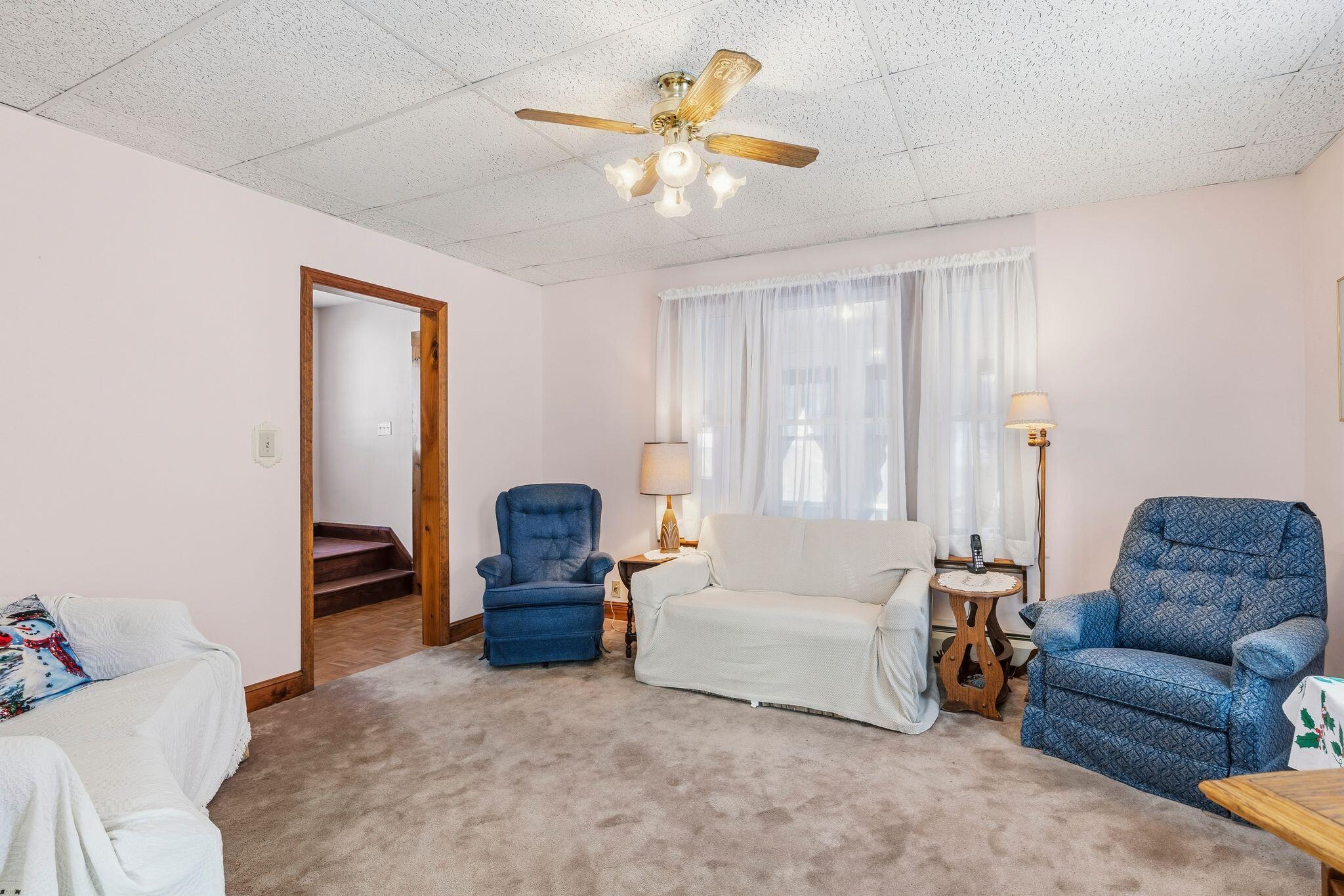 33 Maple Street Limerick, ME 04048 - Photo 15 of 38 Large living room with ceiling fans