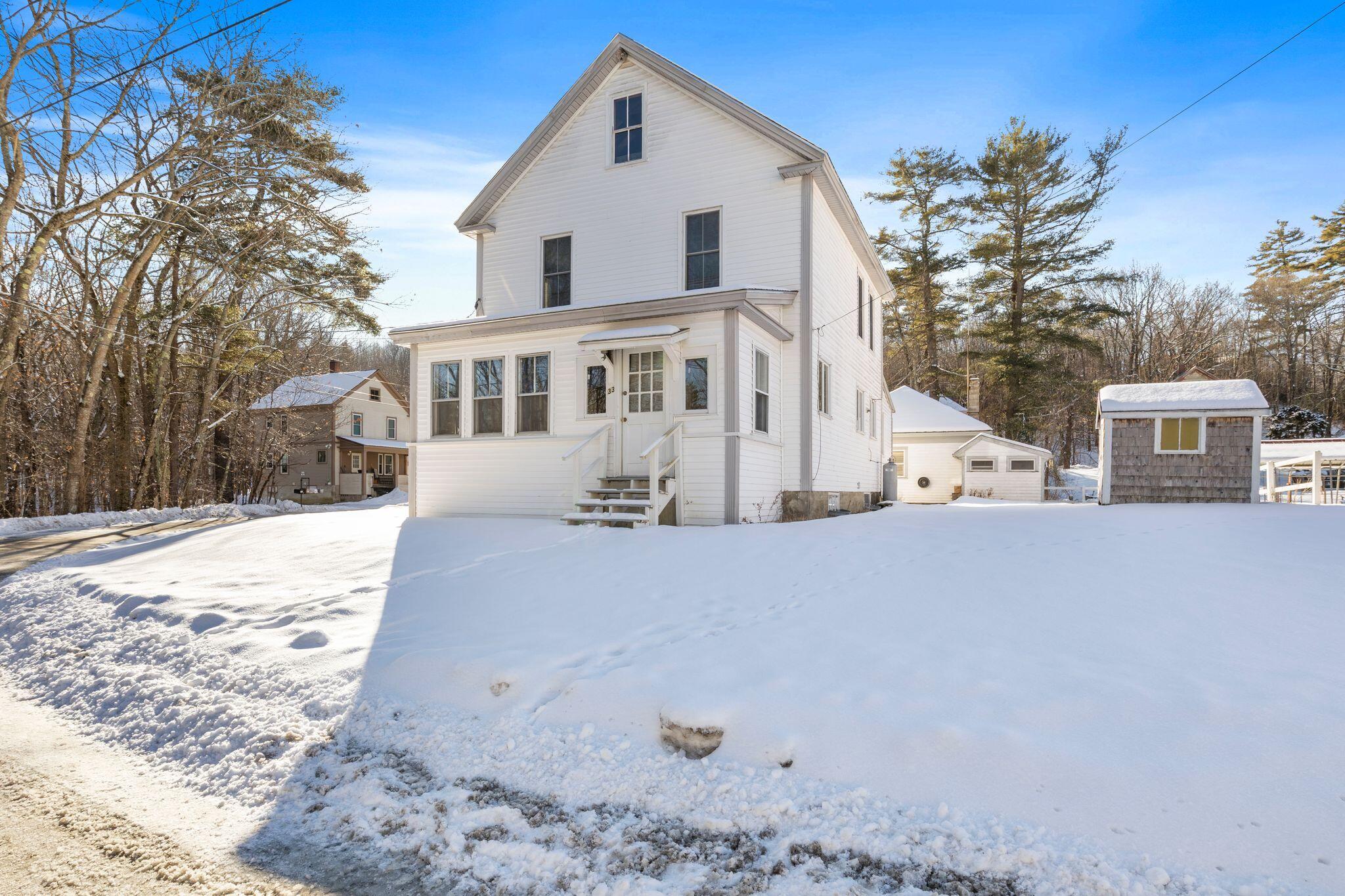33 Maple Street Limerick, ME 04048 - Photo 3 of 38 Front of home, with yard on right side