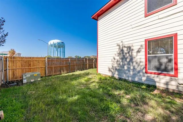 a view of a back yard of the house