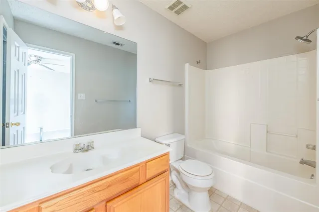 a bathroom with a sink a toilet and a bathtub