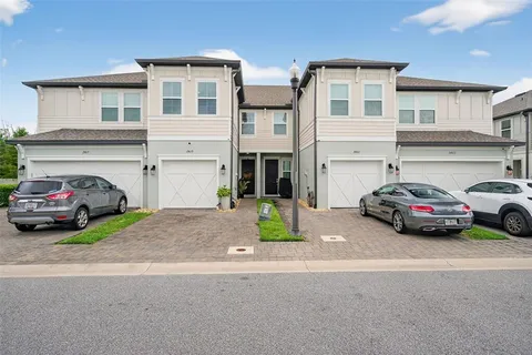 a view of a car parked in front of a house