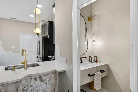a bathroom with a sink and mirror
