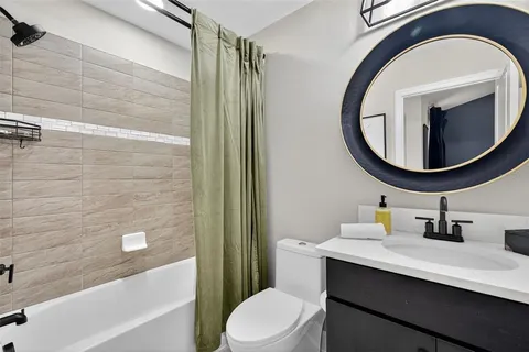 a spacious bedroom with a bed and a window