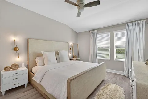 a bedroom with a flat screen tv and a bed