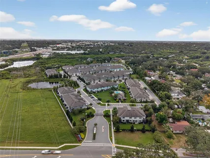 an aerial view of residential houses with outdoor space