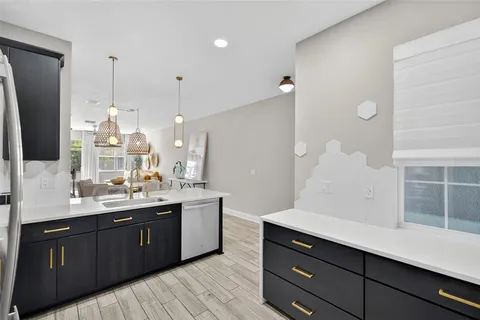a bathroom with a sink double vanity granite and shower