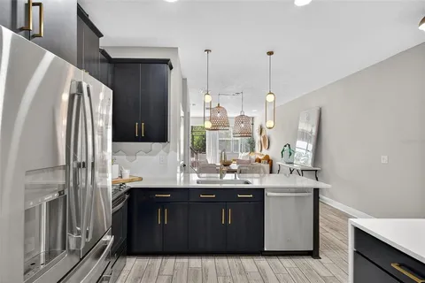 a kitchen with a sink and refrigerator