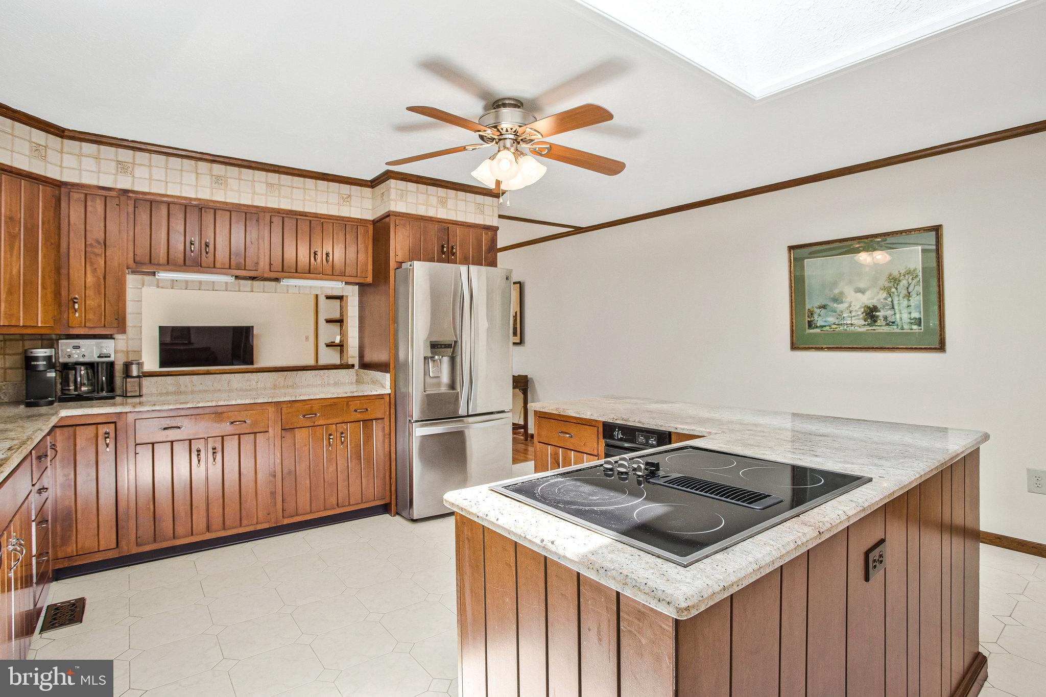 1021 Carson Drive Huntingtown, MD 20639 - Photo 11 of 33 a kitchen that has a cabinets and a stove