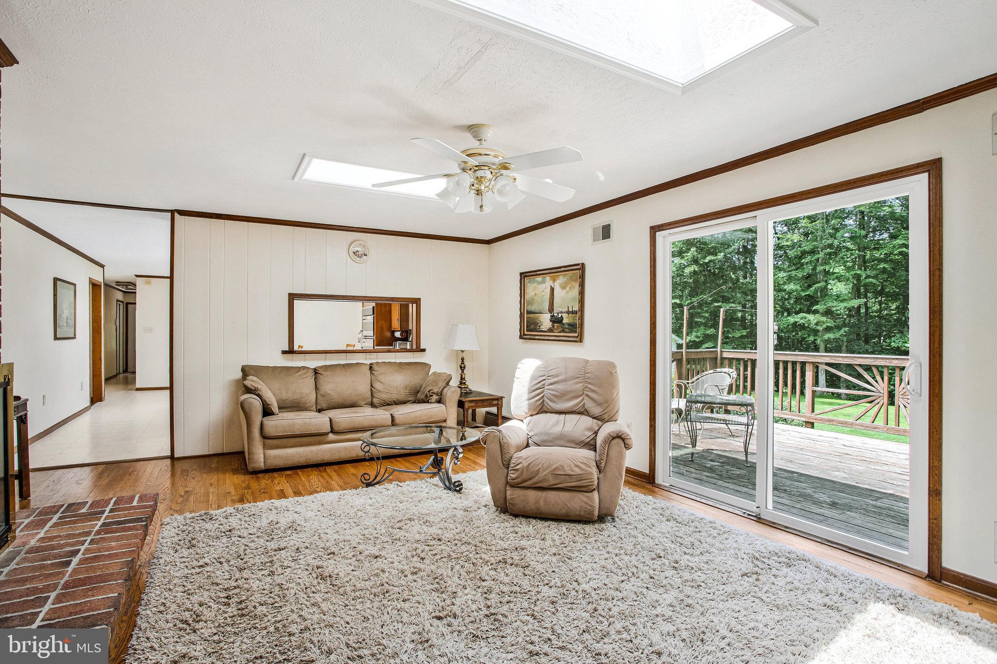 1021 Carson Drive Huntingtown, MD 20639 - Photo 13 of 33 a living room with furniture and a large window