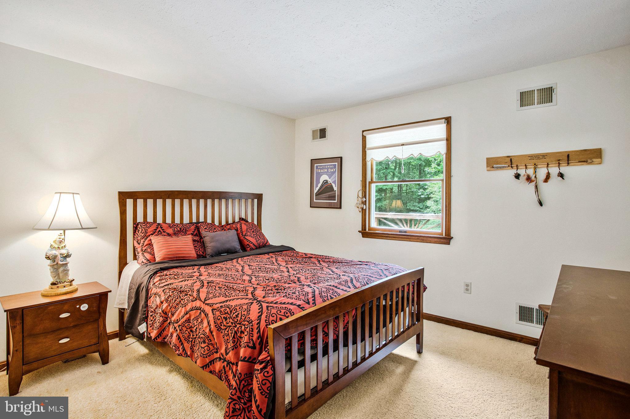 1021 Carson Drive Huntingtown, MD 20639 - Photo 18 of 33 a bedroom with a bed and a window