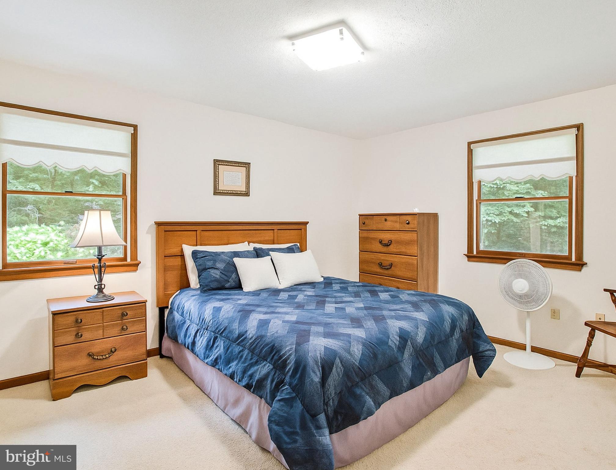 1021 Carson Drive Huntingtown, MD 20639 - Photo 19 of 33 a bedroom with a bed and a window