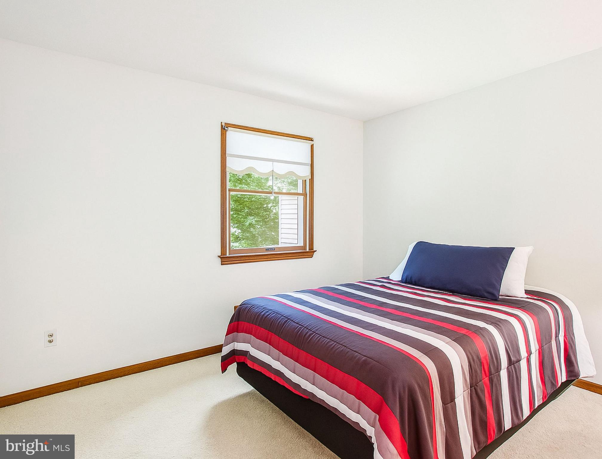1021 Carson Drive Huntingtown, MD 20639 - Photo 20 of 33 a bedroom with a bed and a window