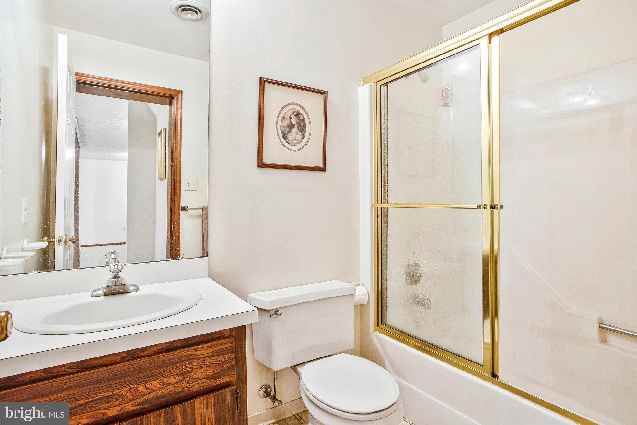 1021 Carson Drive Huntingtown, MD 20639 - Photo 21 of 33 a bathroom with a sink a toilet and shower