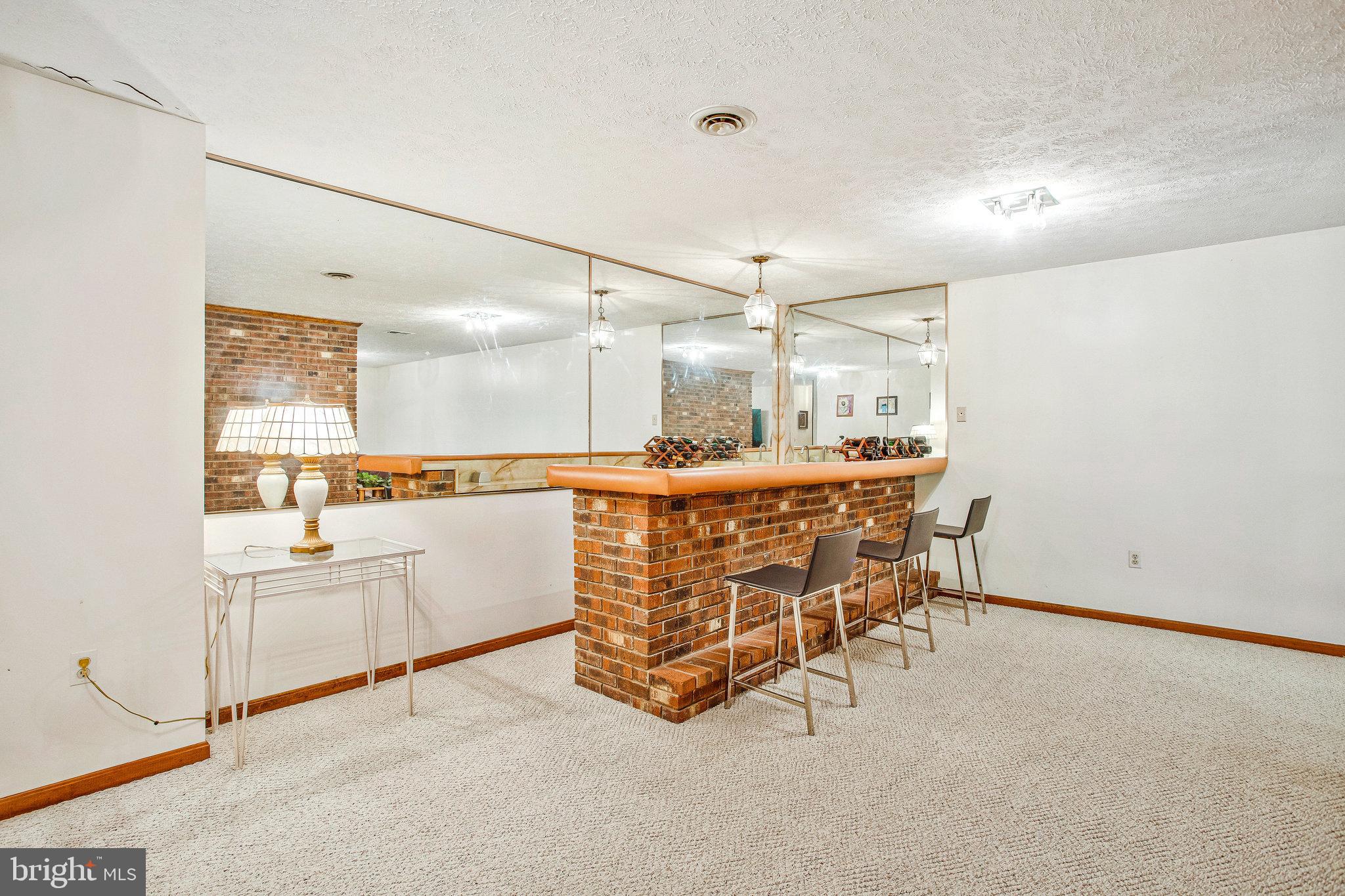 1021 Carson Drive Huntingtown, MD 20639 - Photo 24 of 33 a kitchen with stainless steel appliances kitchen island granite countertop a sink and cabinets
