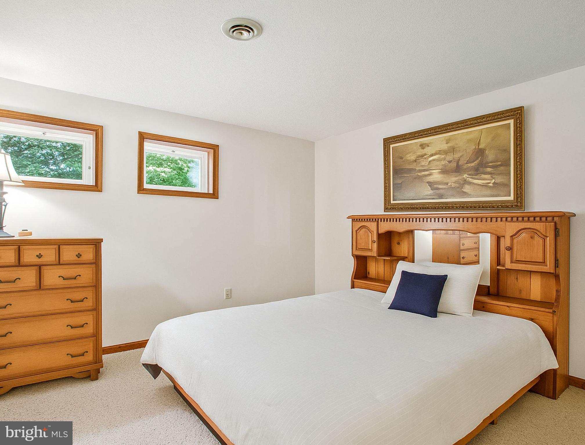1021 Carson Drive Huntingtown, MD 20639 - Photo 25 of 33 a bed room with a bed and a night stand