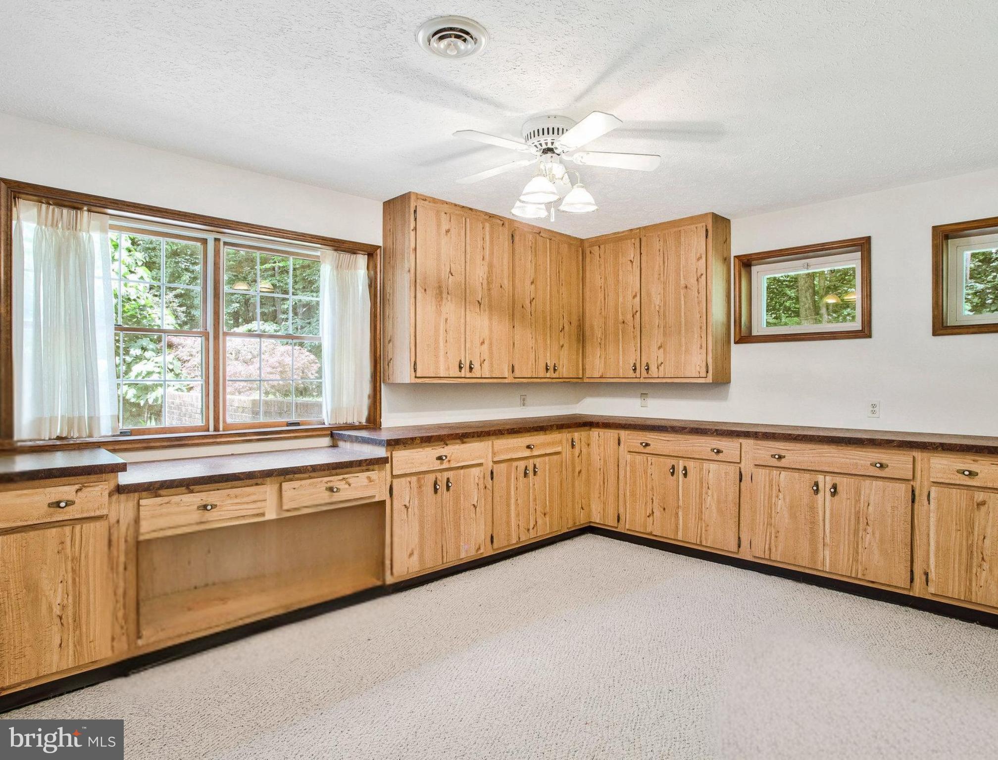 1021 Carson Drive Huntingtown, MD 20639 - Photo 27 of 33 a large kitchen with cabinets