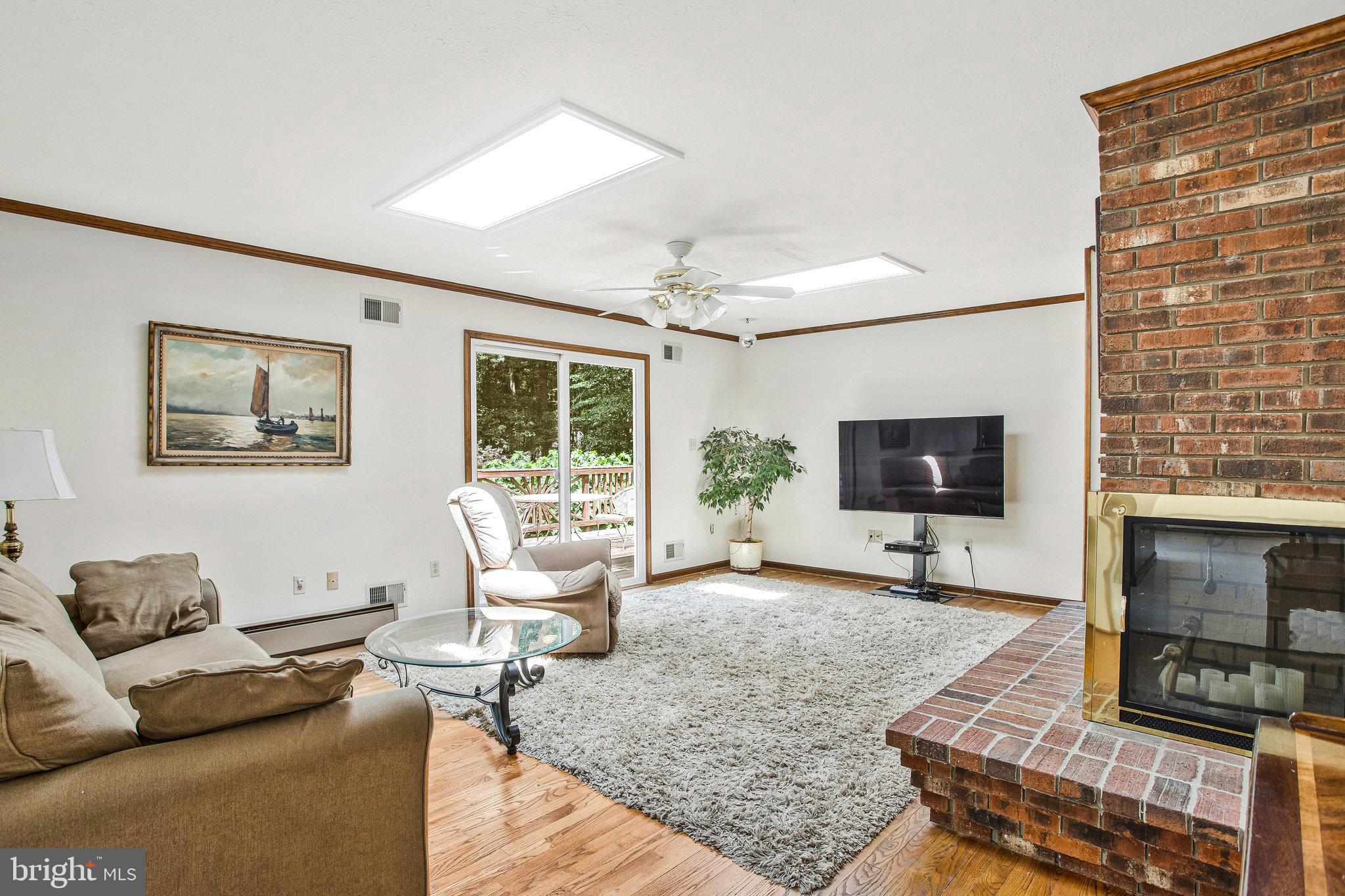 1021 Carson Drive Huntingtown, MD 20639 - Photo 4 of 33 a living room with furniture and a flat screen tv