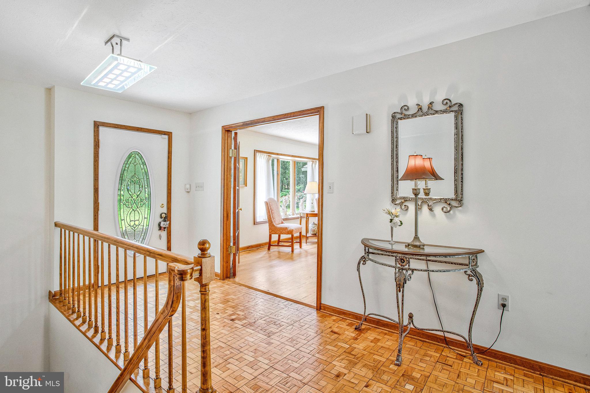 1021 Carson Drive Huntingtown, MD 20639 - Photo 6 of 33 a view of a hallway with wooden floor and windows
