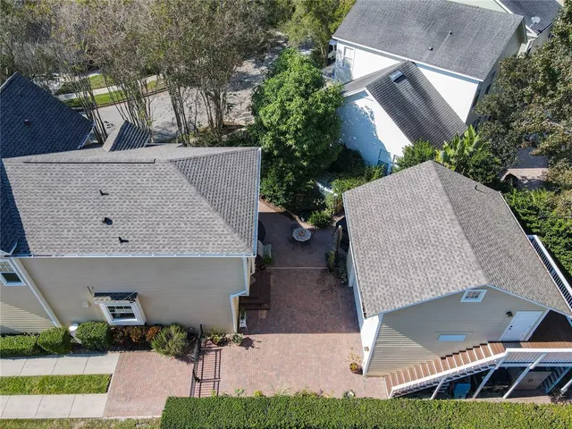 a view of a patio with table and chairs and potted plants