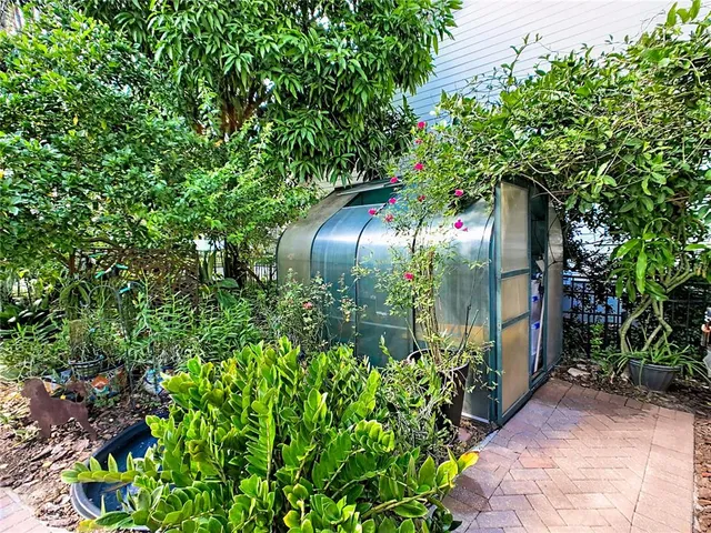 a dining room with furniture a chandelier and window