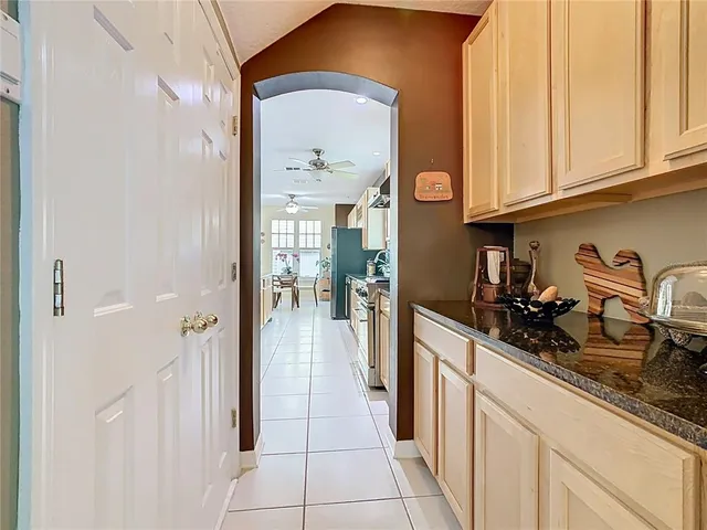 a spacious bedroom with a bed and a table in it