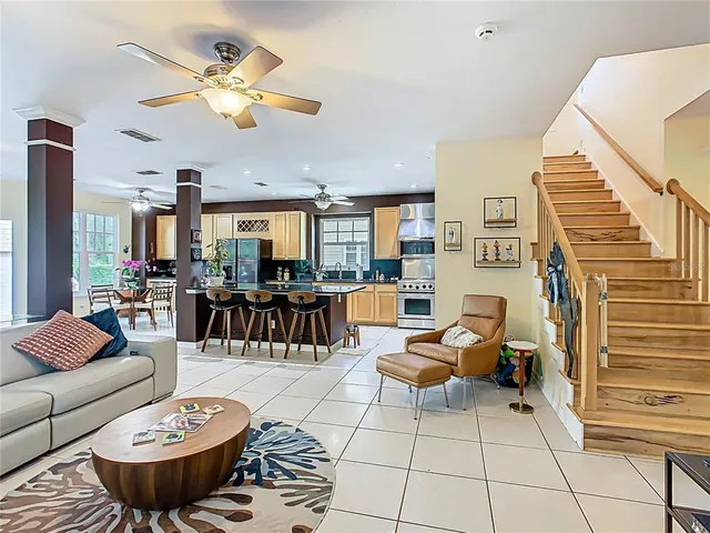 a bedroom with furniture and a book shelf
