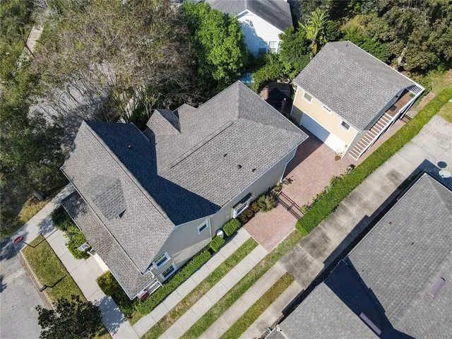 a front view of a house with a yard and a garage