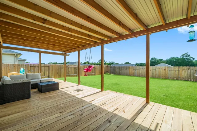 a view of a house with a big yard