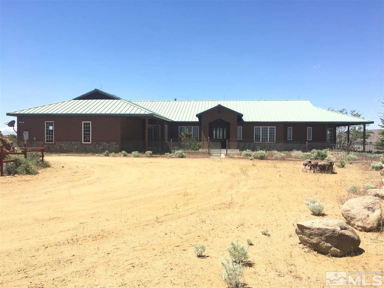 4820 Cactus Canyon Road Reno, NV 89510 - Photo 1 of 1 a view of a house with a yard covered with snow
