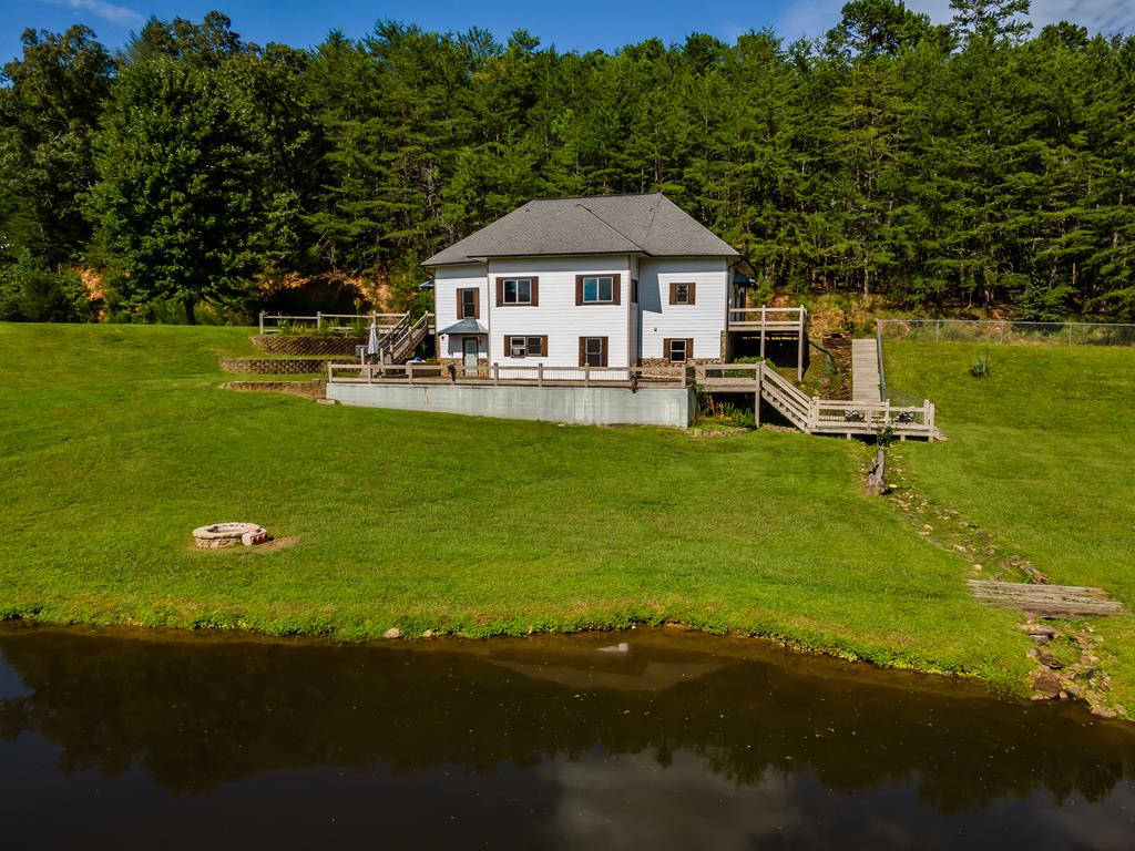 2637 River Road Mineral Bluff, GA 30559 - Photo 1 of 67 a aerial view of a house with swimming pool garden and patio