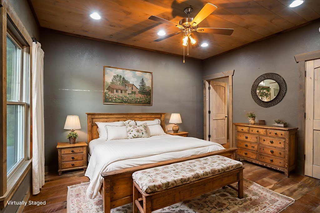 2637 River Road Mineral Bluff, GA 30559 - Photo 14 of 67 a bedroom with a bed a chandelier and a closet